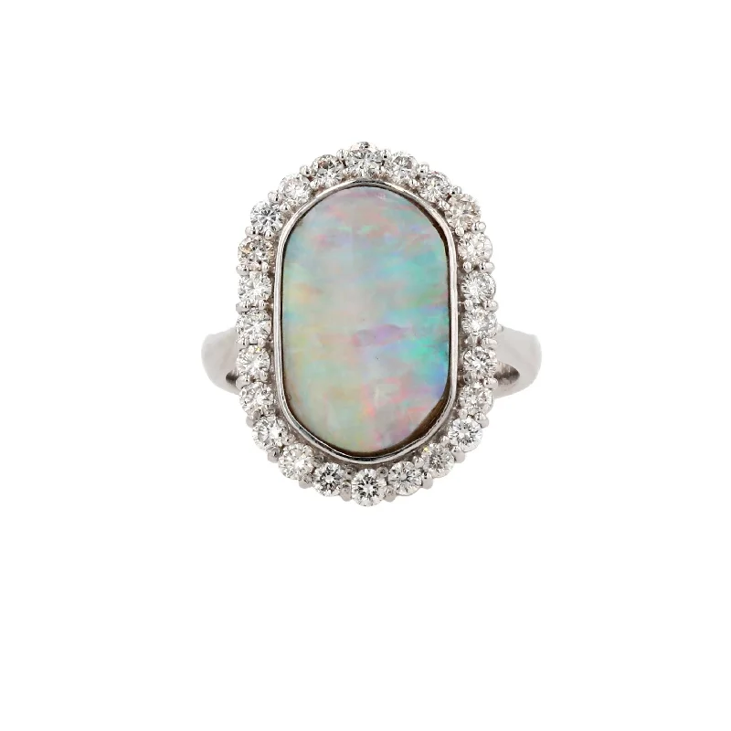 Rings with starburst topaz for radiant beauty -Platinum Oval Opal With Diamond Halo Ring